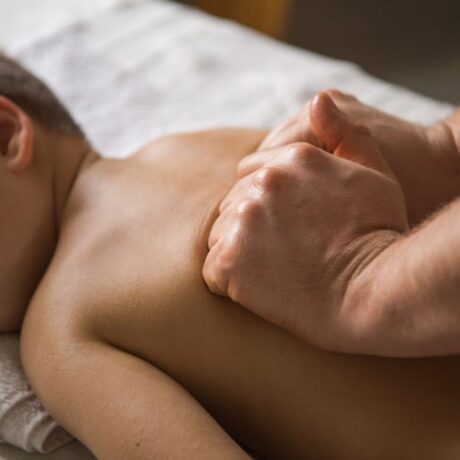 boy-toddler-relaxes-from-therapeutic-massage-physiotherapist-working-with-patient-clinic-back-child7-less-1024×683